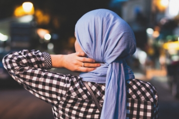 selective focus photograph of person wearing blue headscarf