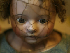 selective focus photography of porcelain doll