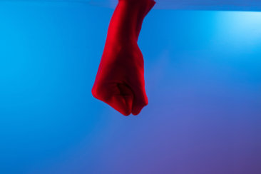 person holding red cotton sock