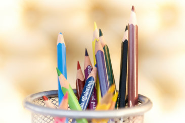 shallow focus photography of pencils on desk rack