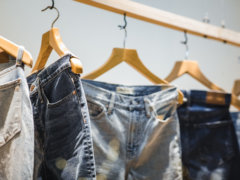 selective focus photography of hanged denim jeans