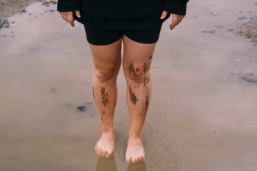 person in black shorts with skin tattoo