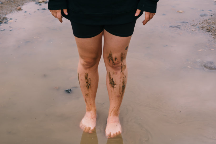 person in black shorts with skin tattoo