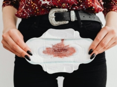 Close-Up Shot of a Person Holding a Sanitary Napkin